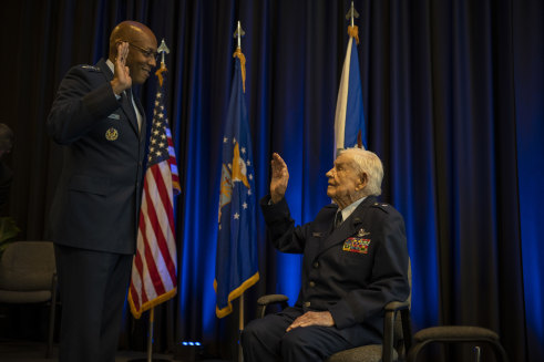 Air Force Chief of Staff General CQ. Brown, Jr administers the reaffirmation of the oath of office to retired Clarence E. “Bud” Anderson, during a ceremony promoting him to the honorary rank of brigadier general.