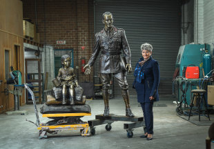 Towering figure: Litsa Athanasiadis with the monument depicting George Treloar and a Greek Pontian refugee girl.