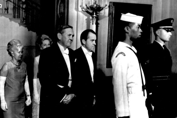President Nixon and Australian Prime Minister John Gorton and their wives follow members of the honor guard to tonight dinner in the White House Honoring Gorton's visit. May 6, 1969. 