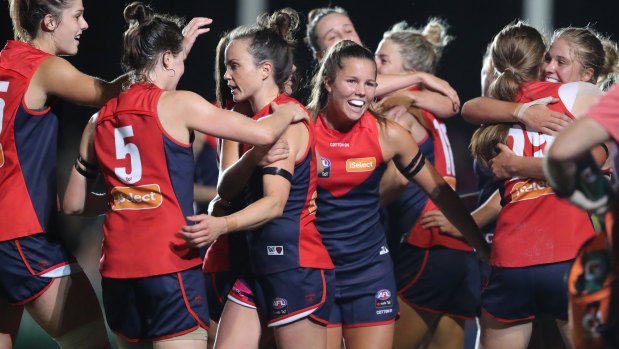 Melbourne players celebrate the narrow win at Casey Fields.