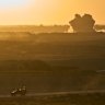 An Israeli army vehicle moves along the Gaza border in southern Israel on Sunday.