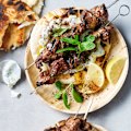 Sticky orange and sumac lamb skewers with pickled cucumber tzatziki.