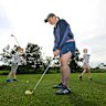 Paige Chrzanowski and her two children Evie (7) and Julian.(5) play golf at Barwon Valley Golf Course. 