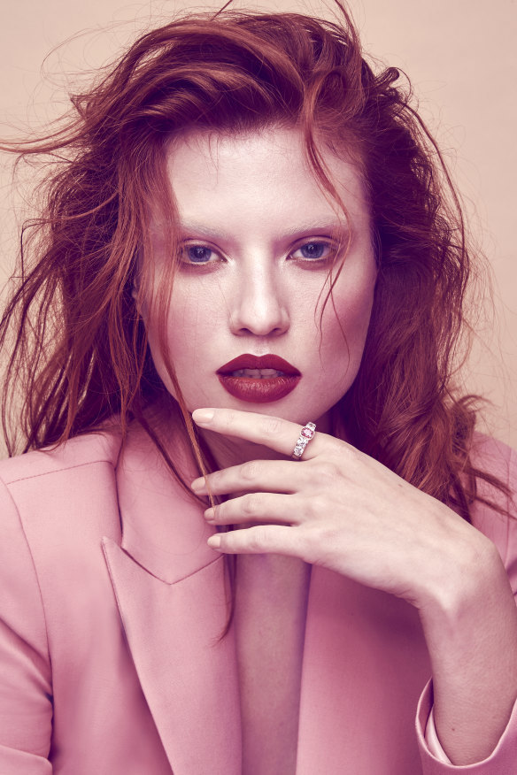 Model wearing a ring featuring pink and white diamonds designed by Musson, retailing for $163,800.