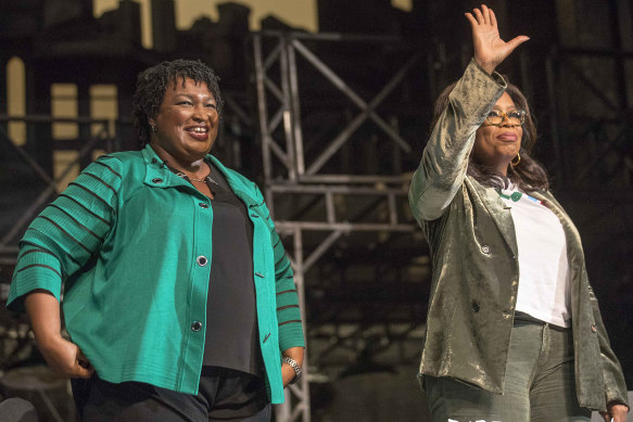 Stacey Abrams with talkshow host Oprah Winfrey, at a town hall talk in Atlanta just days before the midterms.