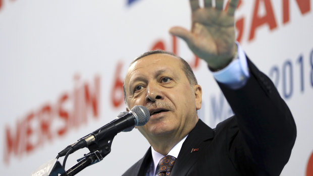 Turkey's President Recep Tayyip Erdogan, gestures during a rally of his ruling Justice and Development (AKP) Party's supporters on Saturday.