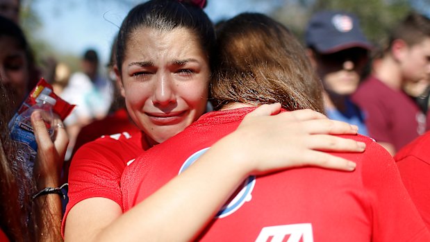 A student mourns the loss of her friend during a community vigil in Parkland, Florida.