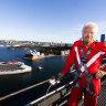 Branson welcomes his $1.1 billion ship, Resilient Lady, from the top of the Sydney Harbour Bridge.