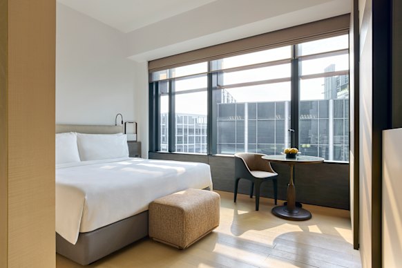 Inside a king room, big windows allow for lots of natural light.