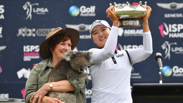 Bearing up well: Jin Young Ko celebrates with her trophy, and 'Honey' the koala (held by Rae Campbell), after winning the Australian Women's Open in Adelaide.