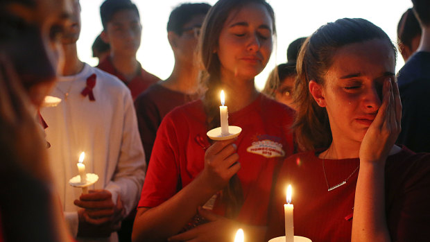 Students grieve at a vigil held for the victims of the school shooting at Parkland, Florida.