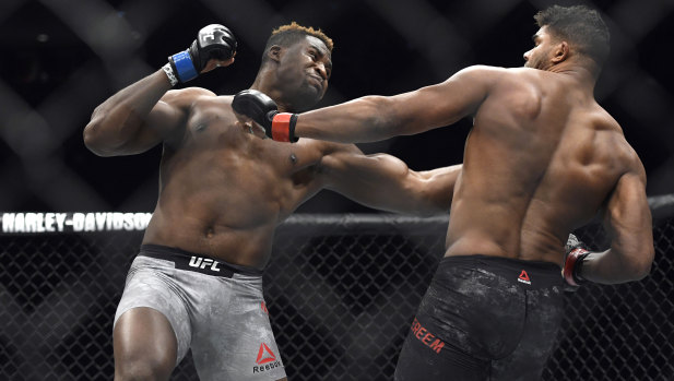 Francis Ngannou (left) hits Alistair Overeem in the first round of their UFC 218 heavyweight bout last December.