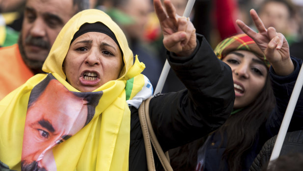 Kurdish immigrants and supporters at a rally in Cologne, Germany, to protest against a Turkish military operation in a Kurdish enclave in northern Syria.