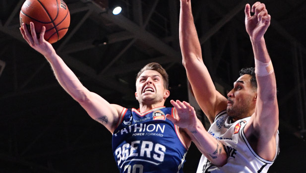 Fightback: Adelaide's Nathan Sobey goes up against United's Tai Wesley during game four of the NBL finals at Titanium Arena in Adelaide.