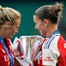 Arsenal’s Leah Williamson and Steph Catley holding the winner trophy defeating FC Barcelona on Saturday.