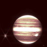 In an undated image provided by NASA, and other agencies, Jupiter, center, and its moon Europa, left, seen through the James Webb Space TelescopeÕs NIRCam instrument 2.12 micron filter.