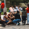 People grieve outside the SSGT Willie de Leon Civic Centre after a school shooting in Texas. 