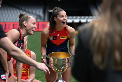 Melbourne captain Katie Hore with the AFLW cup.