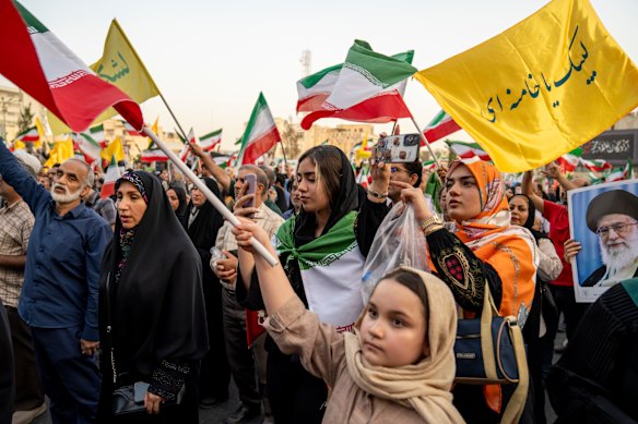 Iranians attend a pro-government demonstration in Tehran on Tuesday.