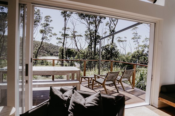 The living room and back deck of Ushka’s look directly onto Pebbly Beach.