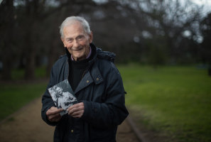 Dr David Quin with a 1941 photo of his father, Dr Bernard 'Ben' Quin, who was murdered by Japanese occupiers of  Nauru in 1943.