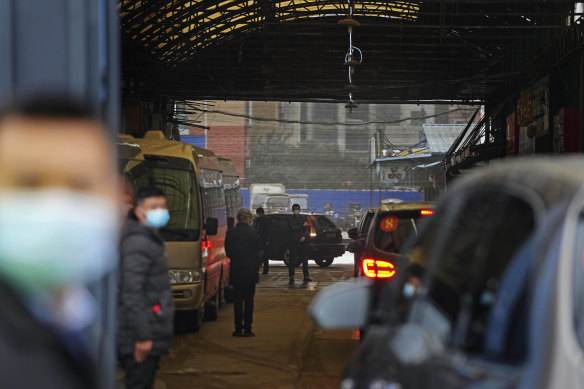 A convoy of vehicles carrying the World Health Organisation team enters the interior of the Huanan Seafood Market in January 2021.