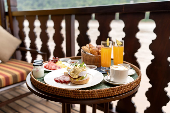 Breakfast on deck: dining includes Laotian and international dishes.