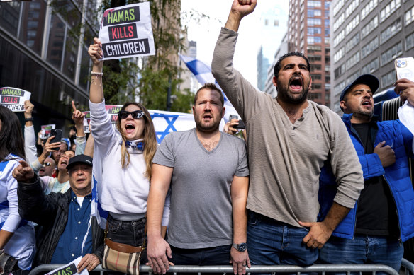 Supporters of Israel gather near the Israeli Consulate in New York, Monday, Oct. 9.