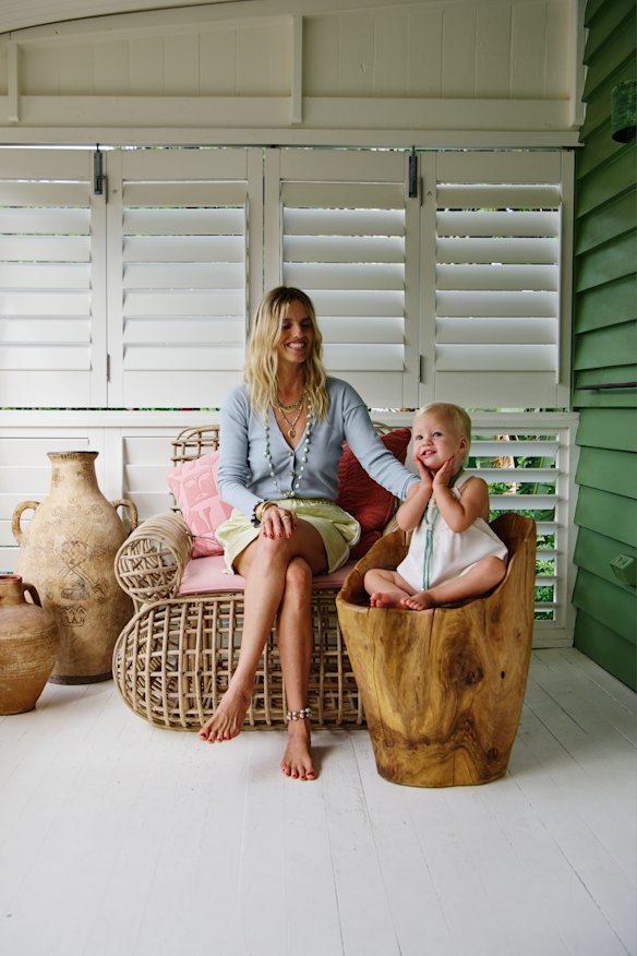 Folk wears Baserange “Tav” cardigan, Lucy Folk “Tufted Wave” miniskirt, Lucy Folk jewellery. Lala wears her own romper.