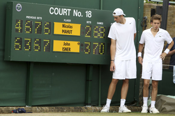 New balls please:  John Isner and Nicolas Mahut went to the absurd lengths of 70-68 in the final set.