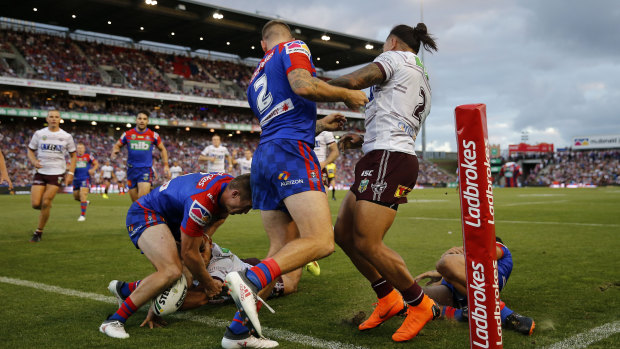Line ball: Brian Kelly of the Sea Eagles scores a second-half try.