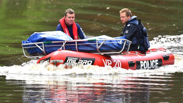 Police retrieve a body from the Yarra on Tuesday afternoon.