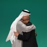 United Nations Climate Chief Simon Stiell, right, and COP28 President Sultan al-Jaber embrace at the COP28