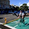 The pop-up cycleway on Moore Park Road remains in place six years after it was installed as a temporary transport measure.