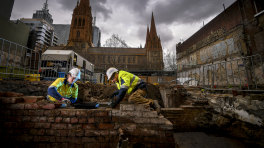 Can you dig it: Workers Wren Lakeman and Joe Page at the archaeological dig opposite St Paul's Cathedral in Swanston Street.