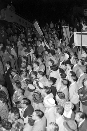 Angry crowds at the airport on April 19, 1954.