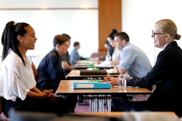 Students going through a mock interview situation to prepare them for a real job.