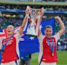 Arsenal’s Australian contingent of Kyra Cooney-Cross, Caitlin Foord and Steph Catley celebrate their Champions League final win.
