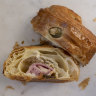 A ham and cheese croissant is
a fat pillow of pastry loaded with gooey cheese and a lolling fold of cured pink meat.