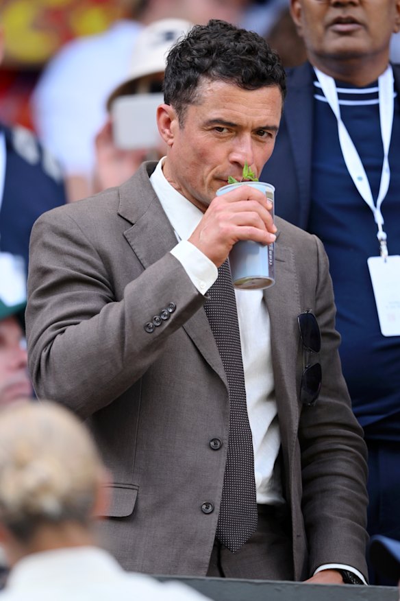 Fresh from his split with singer Katy Perry, Orlando Bloom enjoys the men’s singles final.