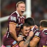 Delighted Brisbane players celebrate a try.
