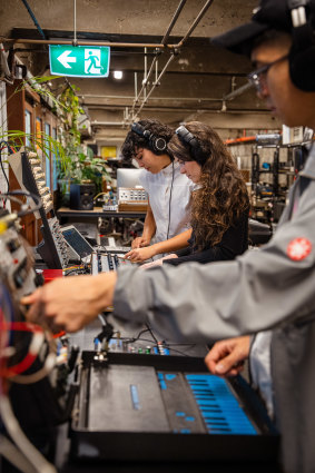 Members of the Melbourne Electronic Sound Studio with historic synthesisers.