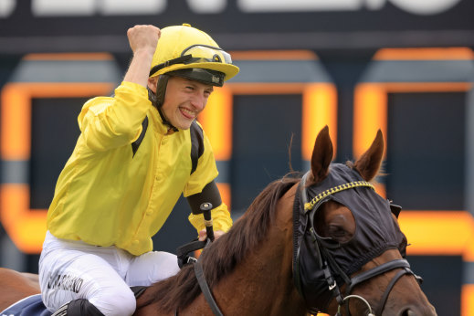 Tom Marquand punches the air after his brilliant ride to take a second Queen Elizabeth Stakes on Addeybb