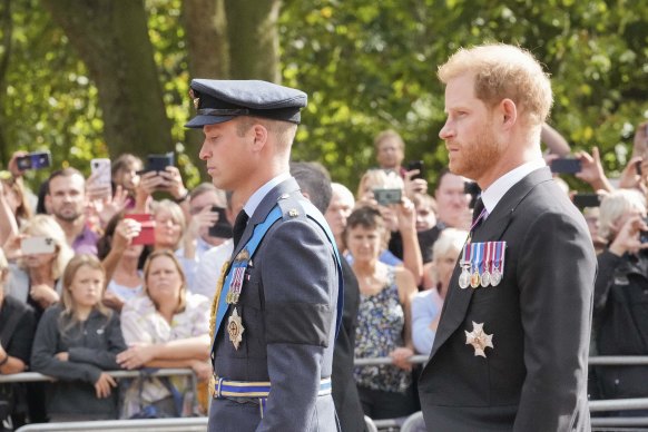 Prince William and Prince Harry walk behind the Queen’s coffin.