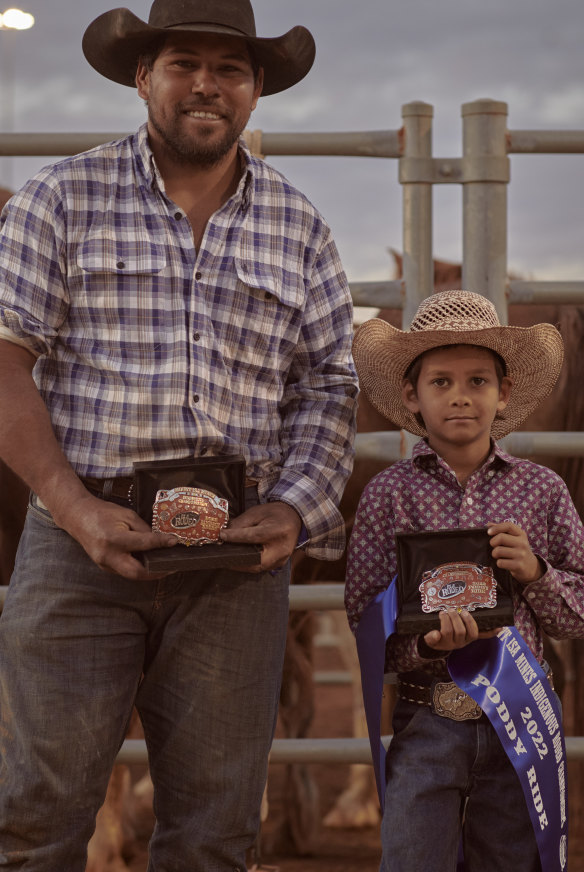 Jason Craigie (with son Rueben), who has been competing in rodeos since age 13.