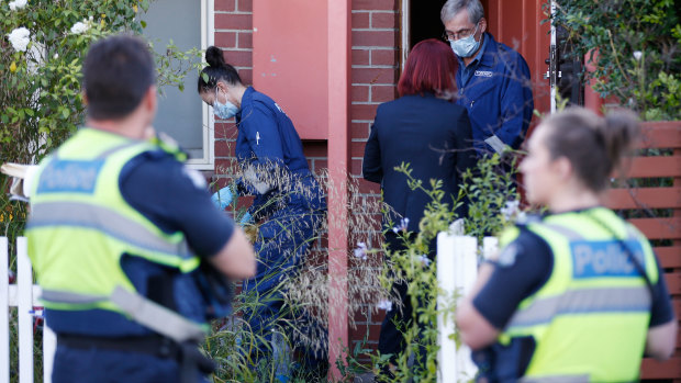 Police at a home in Kensington after the discovery of a body. 