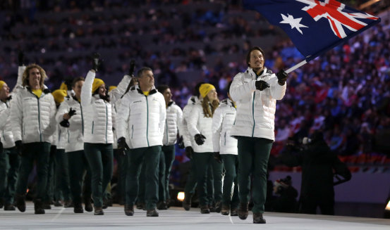 Alex Pullin carries the Australian flag into the stadium during the 2014 Winter Olympics in Sochi. Russian President Vladimir Putin ordered a plane reportedly en route to the ceremony to be shot down.