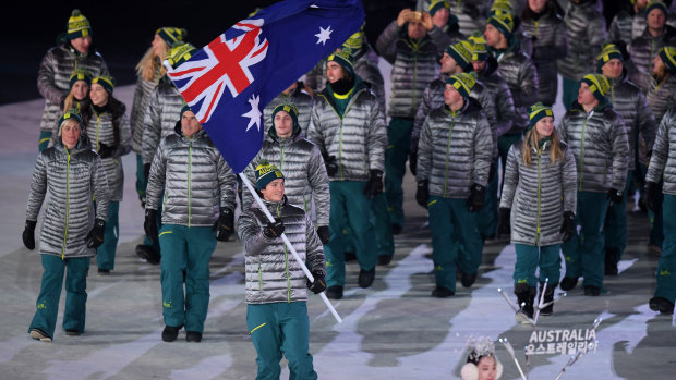 Scotty James leads the Australian team in during the 2018 Winter Olympics Opening Ceremony.