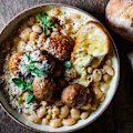 Creamy braised beans with lamb meatballs.