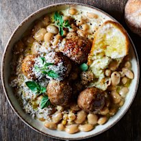 Creamy braised beans with lamb meatballs.